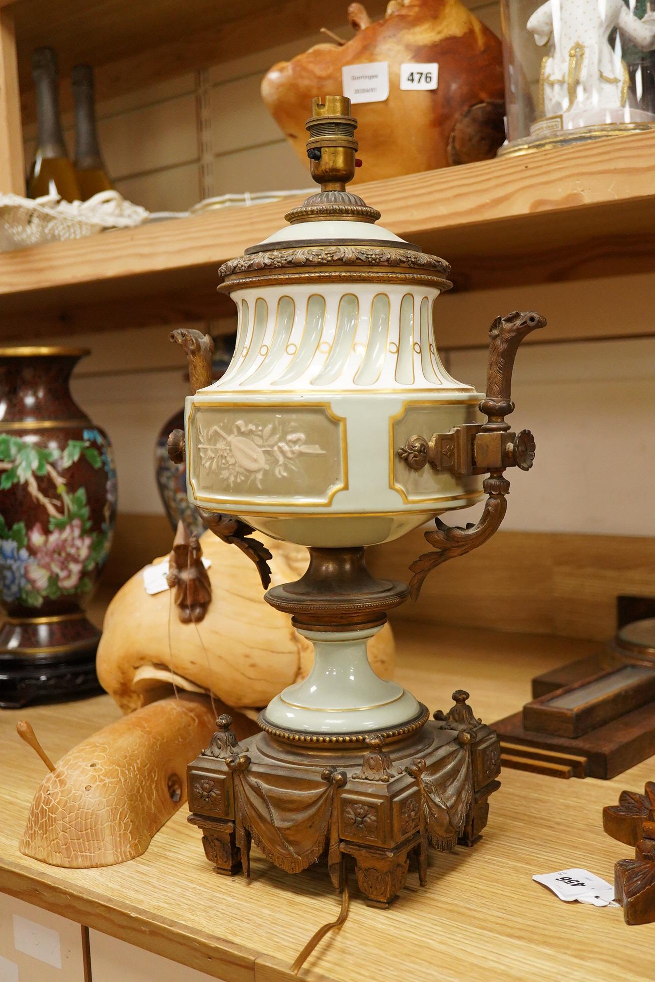 A French Sevres style porcelain and ormolu table lamp, with central decoration of a lyre amongst foliage, 49cm
